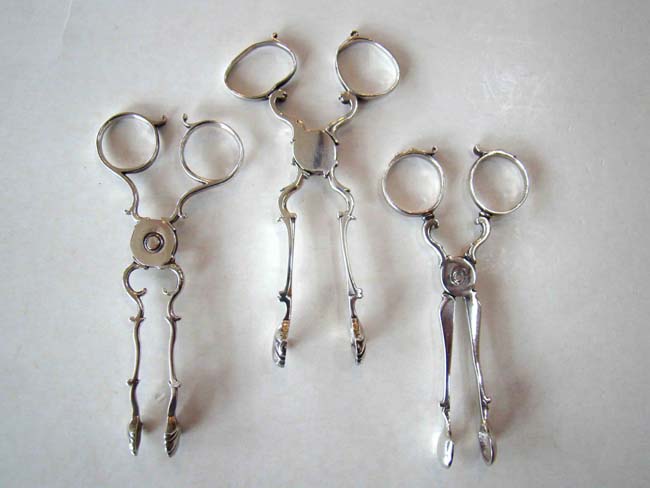 A group of three Georgian silver sugar nips circa 1749-1766